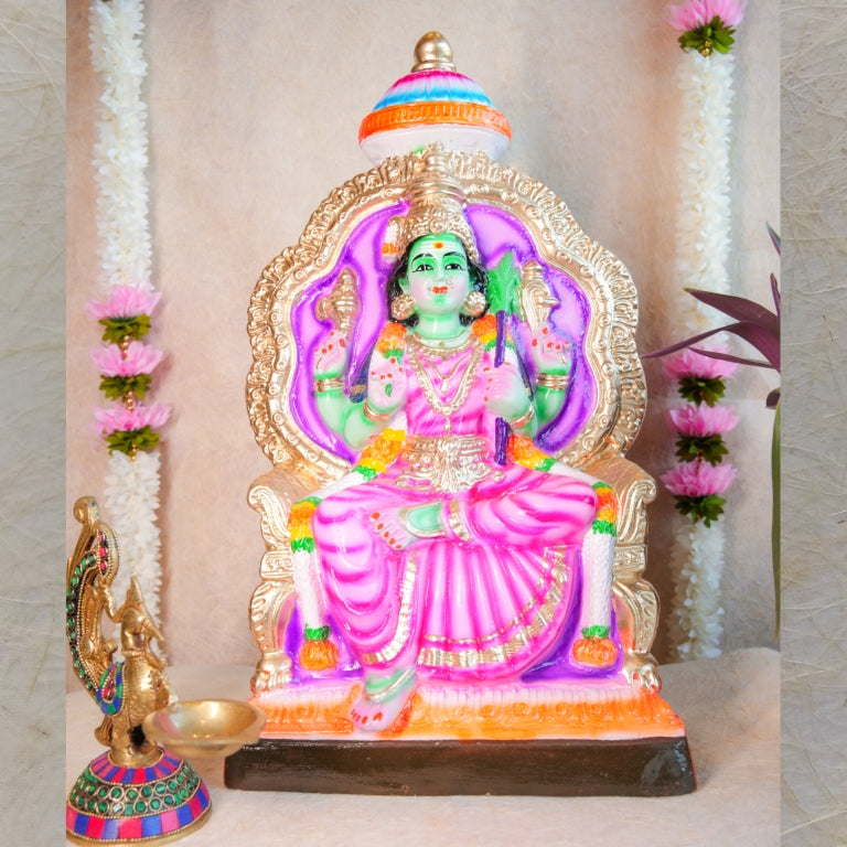 Handcrafted Navarathri Golu doll of Goddess Rajeshwari seated on a golden throne with vibrant pink and green accents.