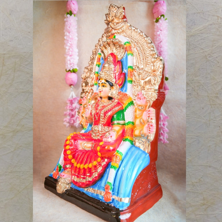 Handcrafted Navarathri Golu doll of Samayapuram Maariamman seated on a decorative throne with vibrant ornaments.