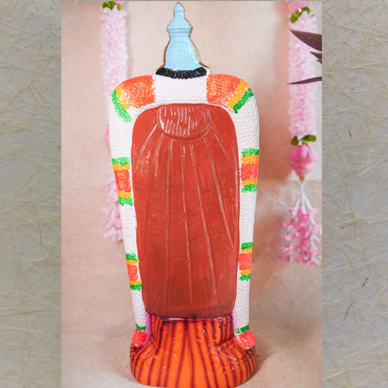 Handcrafted Navarathri Golu doll of Goddess Vishalakshi in a vibrant blue dress, adorned with intricate jewelry and floral garlands.