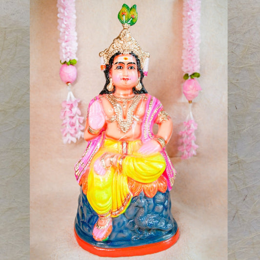 Handcrafted clay doll of Lord Murugan seated in a regal posture, dressed in vibrant colors, perfect for Navarathri Golu decor.