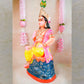 Handcrafted clay doll of Lord Murugan seated in a regal posture, dressed in vibrant colors, perfect for Navarathri Golu decor.