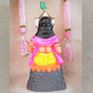 Handcrafted clay doll of Lord Murugan seated in a regal posture, dressed in vibrant colors, perfect for Navarathri Golu decor.
