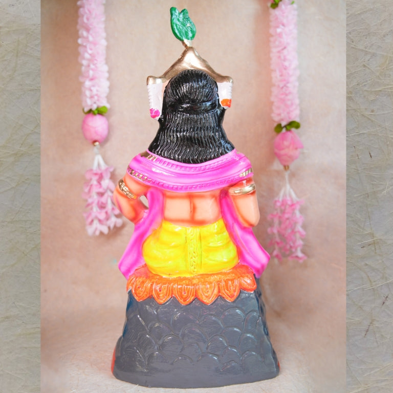 Handcrafted clay doll of Lord Murugan seated in a regal posture, dressed in vibrant colors, perfect for Navarathri Golu decor.