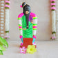 Hand-painted Navarathri Golu Doll of Andal, adorned in a green saree and colorful garlands, symbolizing divine grace and devotion.