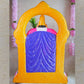 Navarathri Golu Dolls featuring Lalitha Devi holding Tripura Sundari seated within an ornate arch with intricate detailing.