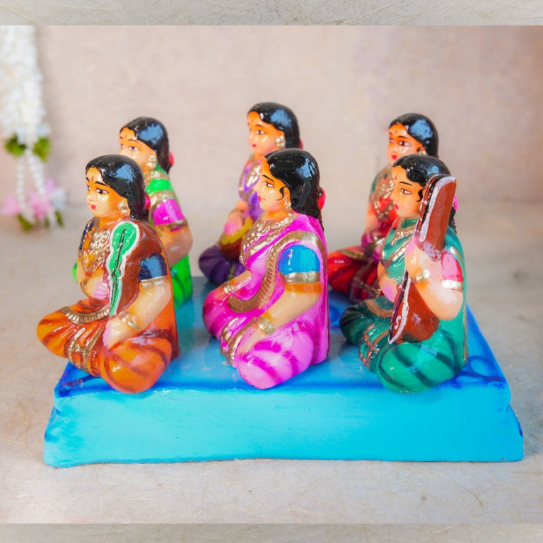 Navarathri Golu Dolls Katcheri Set with vibrant figurines of singers and musicians seated on a platform.