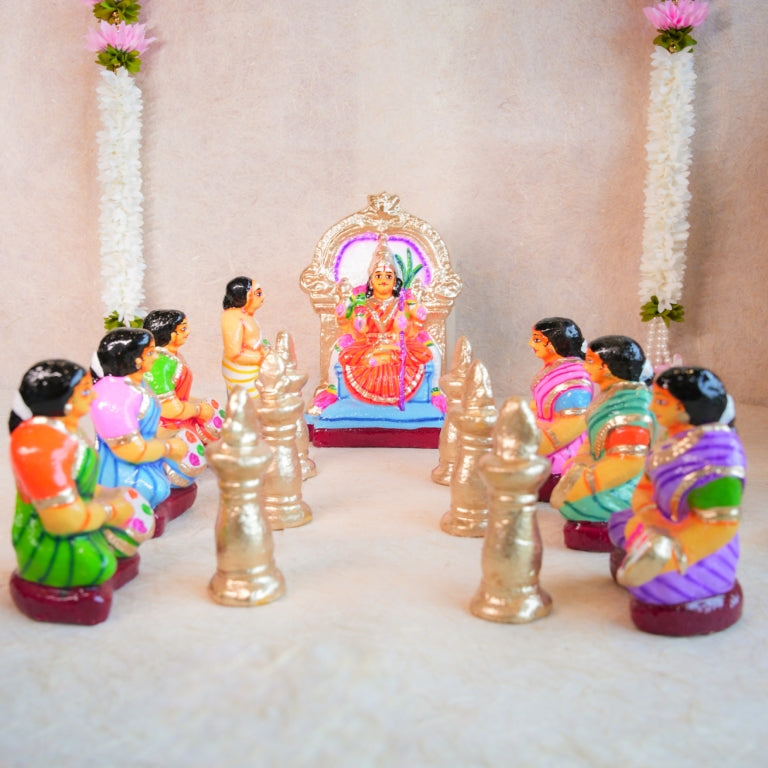 Handcrafted Navarathri Golu Dolls Kamakshi Vilakku Poojai set with Goddess Kamakshi, devotees, and silver lamps in vibrant colors.