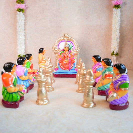 Handcrafted Navarathri Golu Dolls Kamakshi Vilakku Poojai set with Goddess Kamakshi, devotees, and silver lamps in vibrant colors.