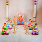 Handcrafted Navarathri Golu Dolls Kamakshi Vilakku Poojai set with Goddess Kamakshi, devotees, and silver lamps in vibrant colors.
