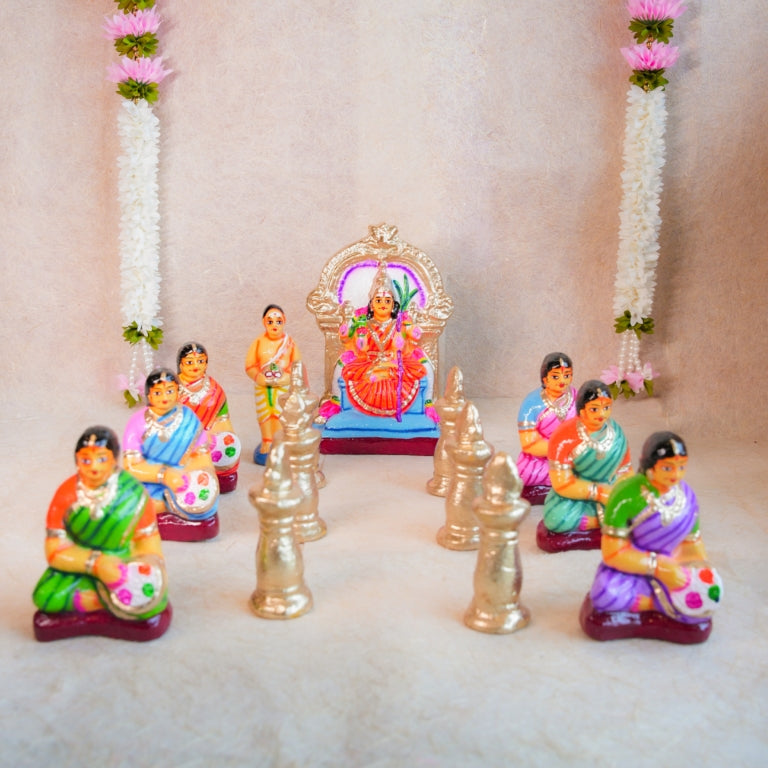 Handcrafted Navarathri Golu Dolls Kamakshi Vilakku Poojai set with Goddess Kamakshi, devotees, and silver lamps in vibrant colors.