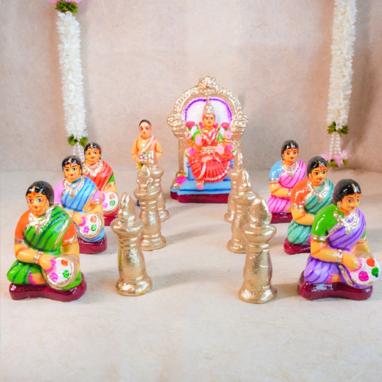 Handcrafted Navarathri Golu Dolls Lakshmi Vilakku Poojai set featuring Goddess Lakshmi, devotees, and traditional lamps in vibrant colors.