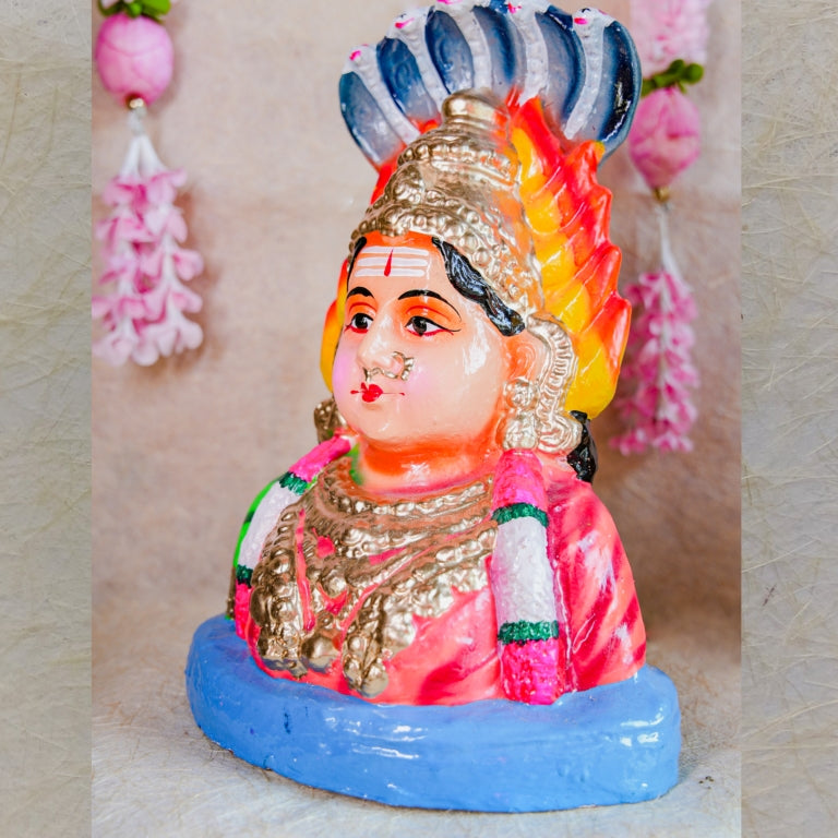 Hand-painted Navarathri Golu Doll of Karumari Amman Bust with vibrant colors, cobra hood, and traditional ornamentation.