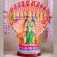 Handcrafted Navarathri Golu Doll of Nava Durga under a serpent canopy, adorned in vibrant colors with a lion mount.