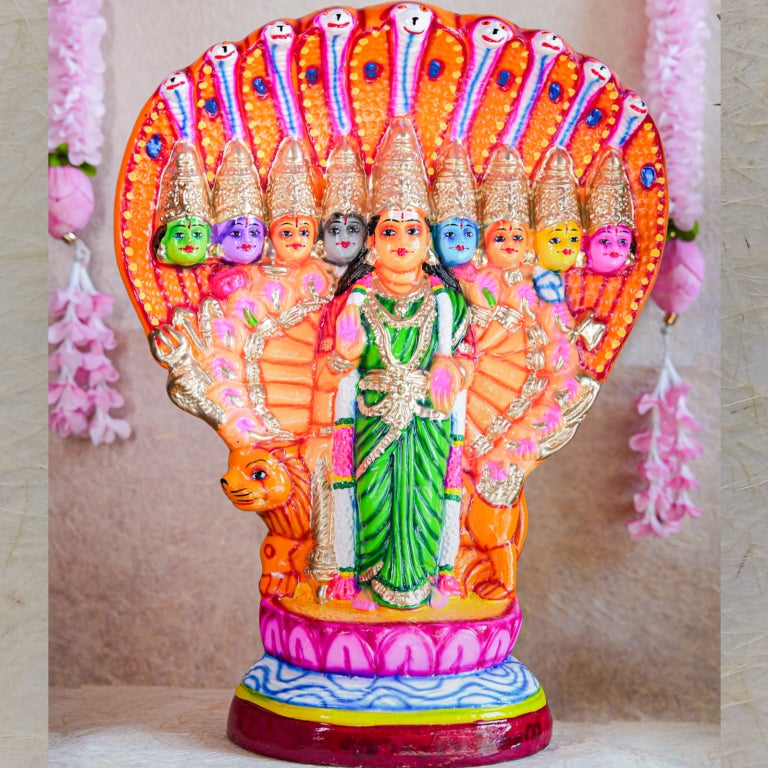 Handcrafted Navarathri Golu Doll of Nava Durga under a serpent canopy, adorned in vibrant colors with a lion mount.