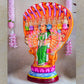 Handcrafted Navarathri Golu Doll of Nava Durga under a serpent canopy, adorned in vibrant colors with a lion mount.