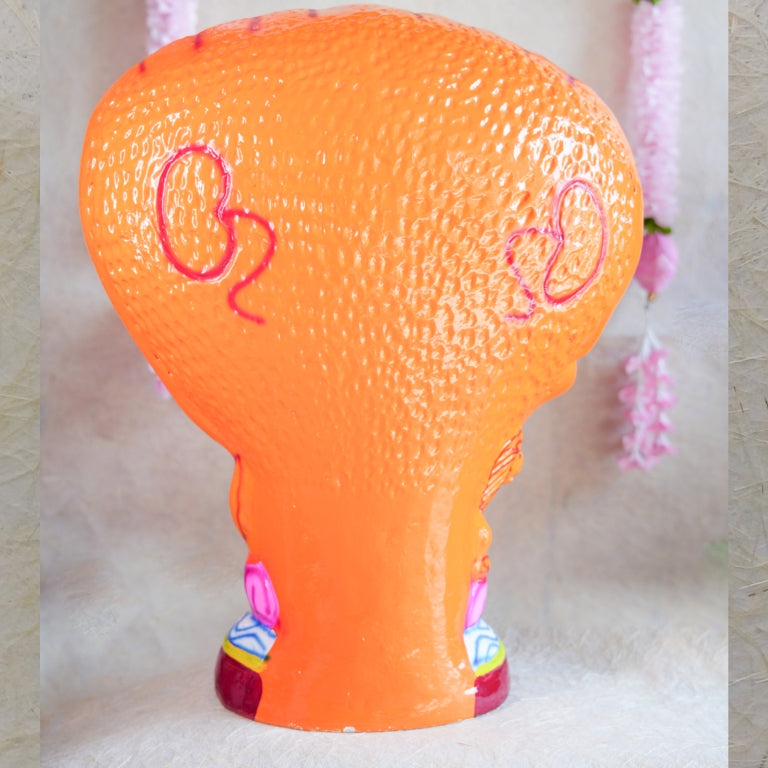 Handcrafted Navarathri Golu Doll of Nava Durga under a serpent canopy, adorned in vibrant colors with a lion mount.
