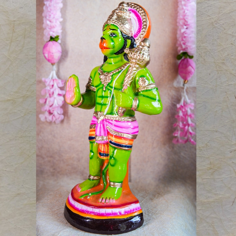 Hand-painted Navarathri Golu Doll of Lord Hanuman holding a Gada in vibrant green with detailed embellishments.