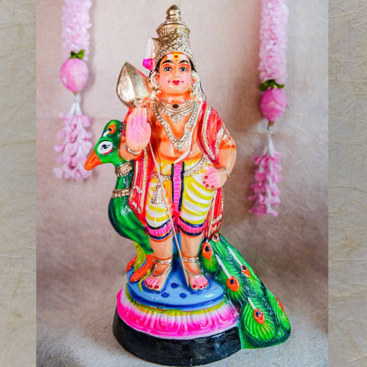 Handcrafted Navarathri Golu Doll of Lord Murugan standing beside a colorful peacock with intricate detailing.
