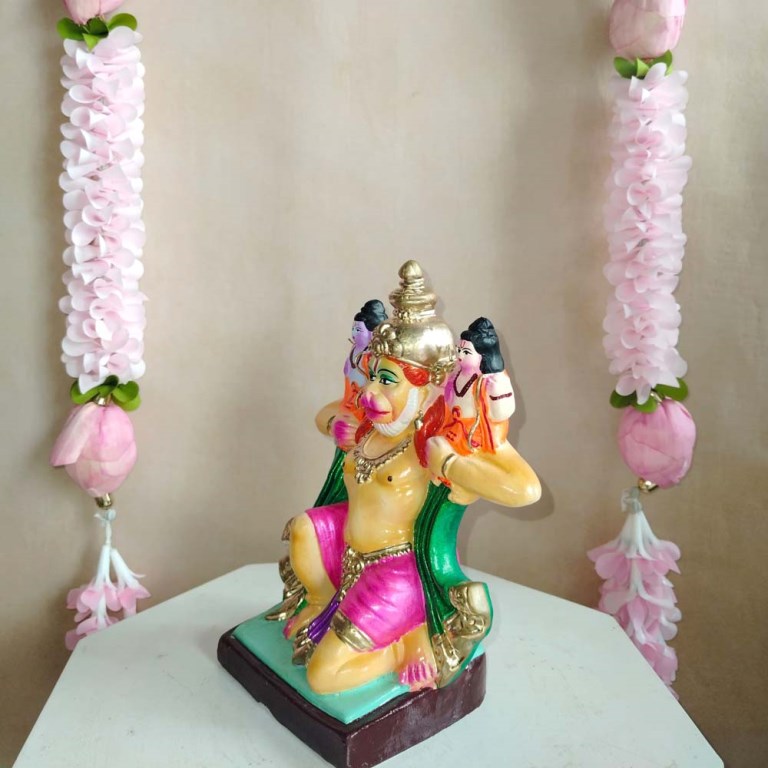 Handcrafted Navarathri Golu doll showing Hanuman carrying Lord Ram and Lakshman on his shoulders in vibrant colors.