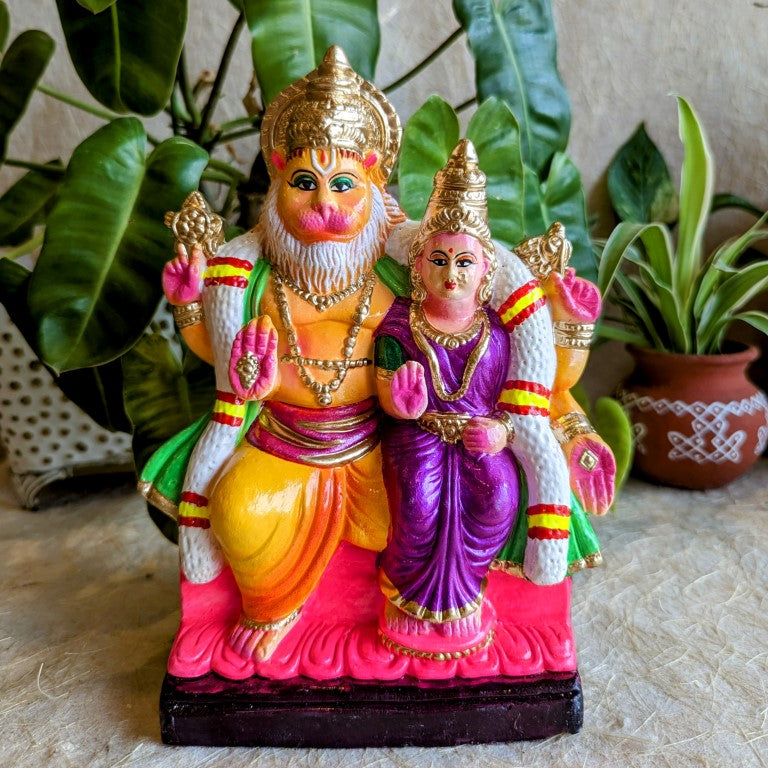 Handcrafted Navarathri Golu Doll of Lakshmi Narasimha seated with Goddess Lakshmi in vibrant colors, perfect for festive displays.