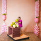 Handcrafted Golu Doll depicting a traditional coconut seller with fresh coconuts on a table, designed for Navarathri Golu.