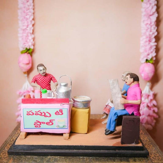 Occupational Golu Dolls depicting a traditional Indian tea stall with a vendor and customers, hand-painted clay figurines for Navarathri Golu.