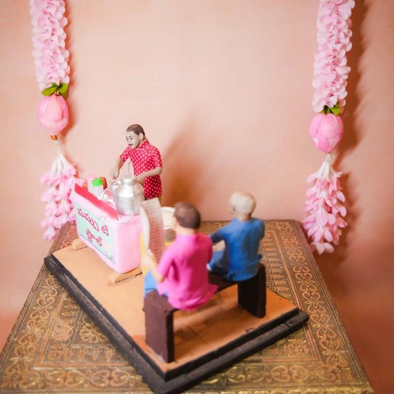 Occupational Golu Dolls depicting a traditional Indian tea stall with a vendor and customers, hand-painted clay figurines for Navarathri Golu.