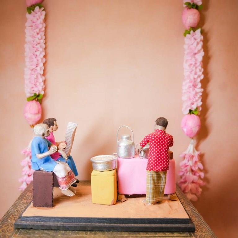 Occupational Golu Dolls depicting a traditional Indian tea stall with a vendor and customers, hand-painted clay figurines for Navarathri Golu.