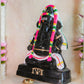 Handcrafted Black Ganesh Navaratri Golu Doll with vibrant garlands and intricate detailing, perfect for festive and spiritual decor.
