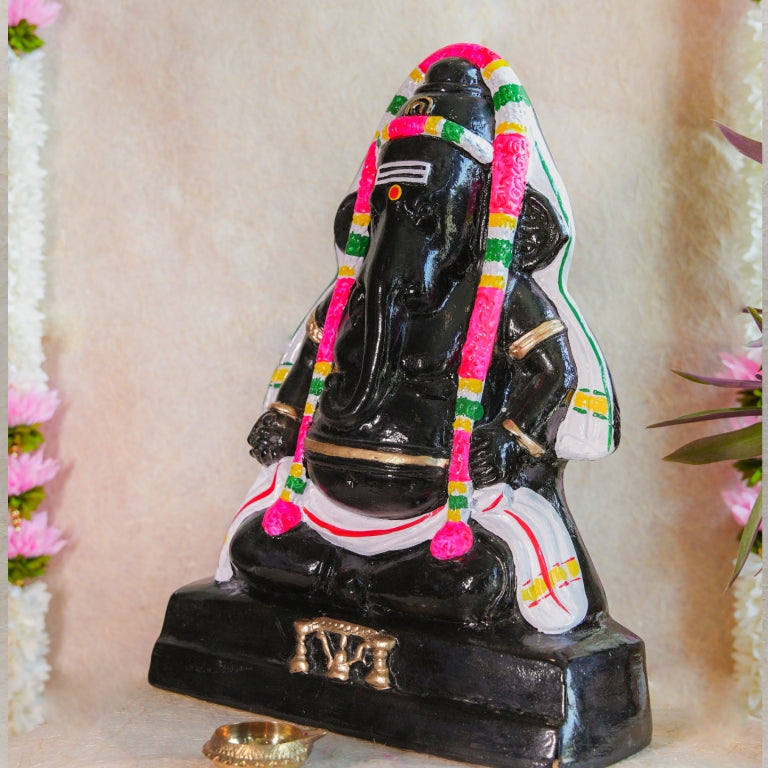 Handcrafted Black Ganesh Navaratri Golu Doll with vibrant garlands and intricate detailing, perfect for festive and spiritual decor.