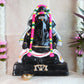Handcrafted Black Ganesh Navaratri Golu Doll with vibrant garlands and intricate detailing, perfect for festive and spiritual decor.