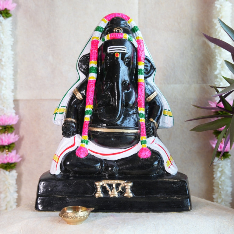 Handcrafted Black Ganesh Navaratri Golu Doll with vibrant garlands and intricate detailing, perfect for festive and spiritual decor.