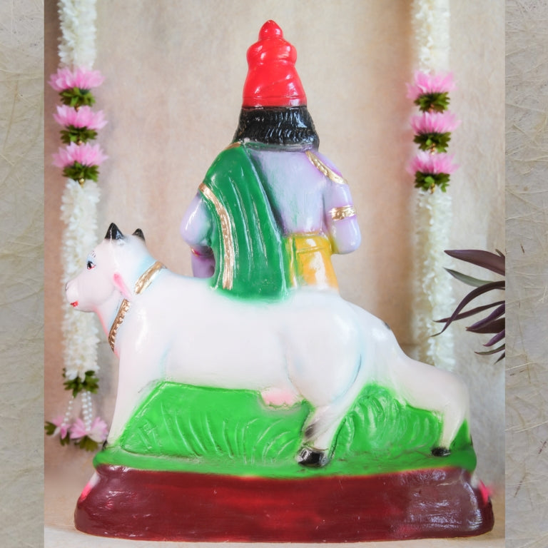 Handcrafted Krishna Mannarkudi Rajagopalan Navaratri Golu Doll with vibrant colors and intricate detailing, featuring cows and divine symbolism.