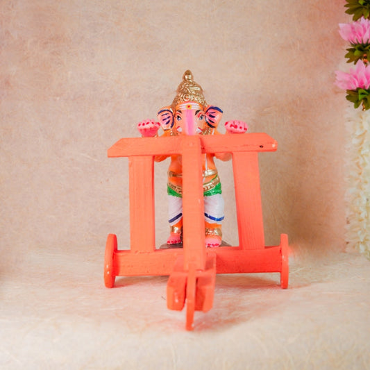 Handcrafted Nadaivandi Vinayagar idol featuring baby Ganesha on a wooden walker with vibrant colors for Navaratri Golu.