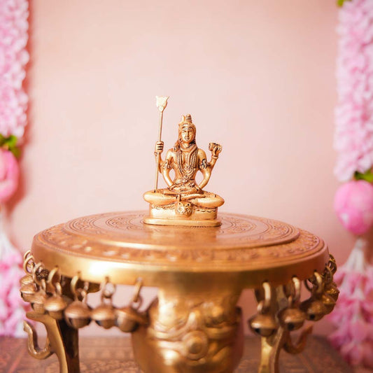 Handcrafted Small Brass Shiva Idol featuring intricate detailing of Lord Shiva seated with a trident and damru.