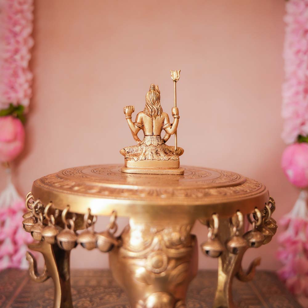 Handcrafted Small Brass Shiva Idol featuring intricate detailing of Lord Shiva seated with a trident and damru.