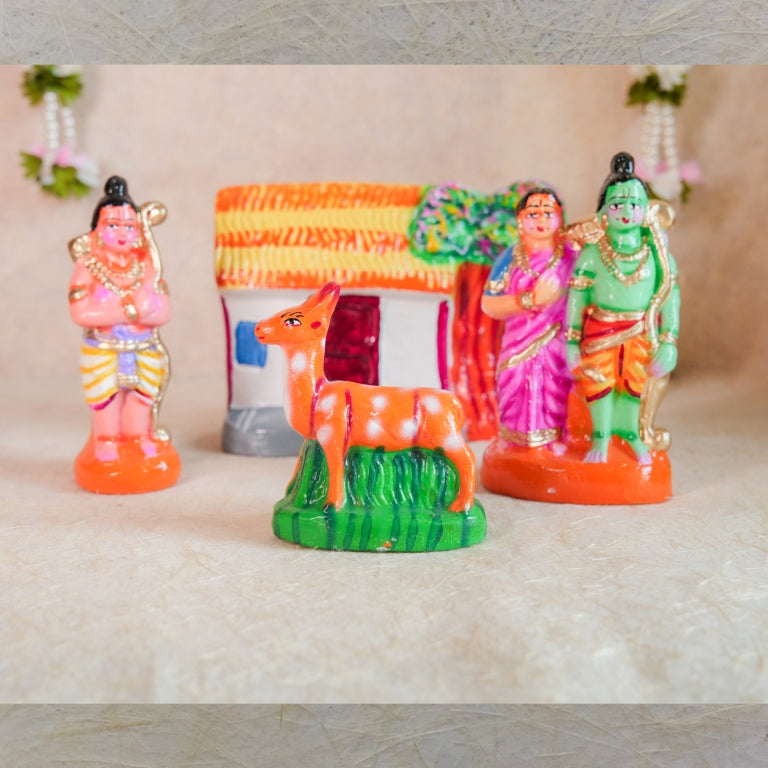 Handcrafted Navarathri Golu doll set featuring Lord Rama, Sita, Lakshmana, and the golden deer, with a hut and forest backdrop.