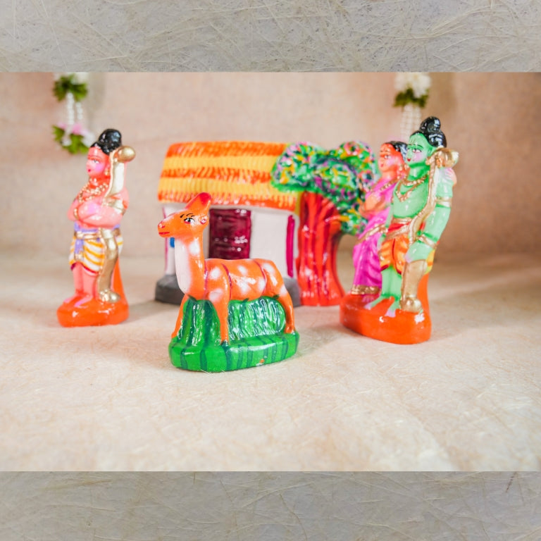 Handcrafted Navarathri Golu doll set featuring Lord Rama, Sita, Lakshmana, and the golden deer, with a hut and forest backdrop.