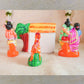 Handcrafted Navarathri Golu doll set featuring Lord Rama, Sita, Lakshmana, and the golden deer, with a hut and forest backdrop.
