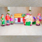 Handcrafted Navarathri Golu doll set featuring a decorated bull, a rural family, a house, and a storyteller.