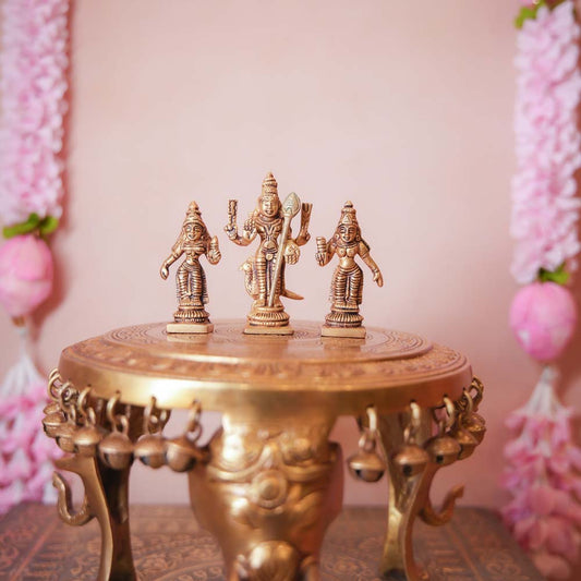 Handcrafted Brass Murugan Set featuring Lord Murugan with Valli and Devasena, intricately detailed and perfect for home temples and Navaratri displays.