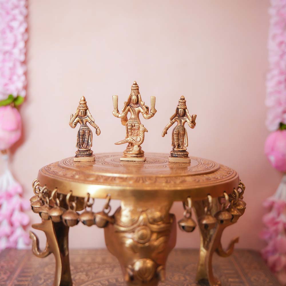 Handcrafted Brass Murugan Set featuring Lord Murugan with Valli and Devasena, intricately detailed and perfect for home temples and Navaratri displays.