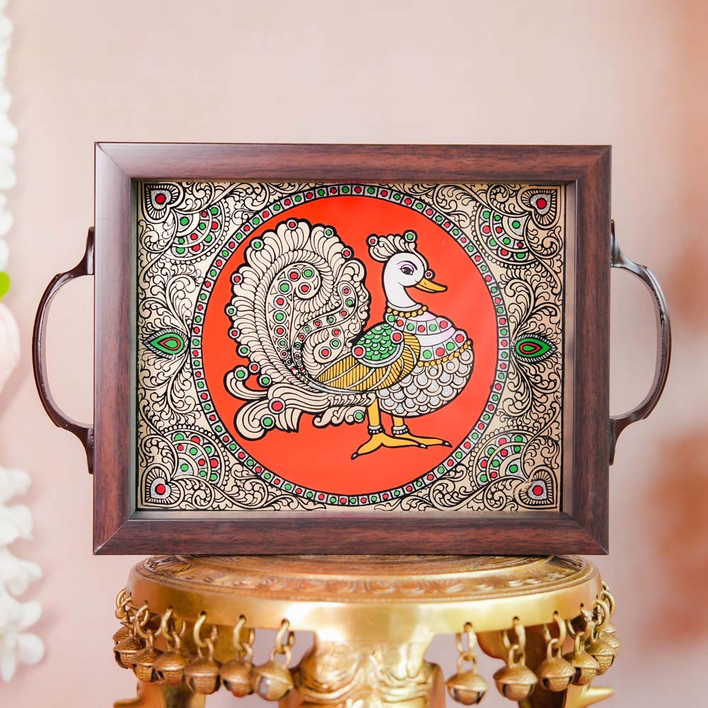 Decorative tray featuring a hand-painted Annam (swan) design on a vibrant orange background, framed with dark wood and metallic handles, displayed on a traditional brass stand.