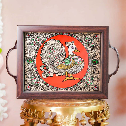 Decorative tray featuring a hand-painted Annam (swan) design on a vibrant orange background, framed with dark wood and metallic handles, displayed on a traditional brass stand.