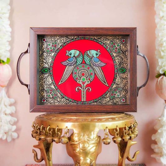 Decorative tray with twin parrot artwork on a vibrant red background, framed with dark wood and metallic handles, displayed on a traditional brass stand.
