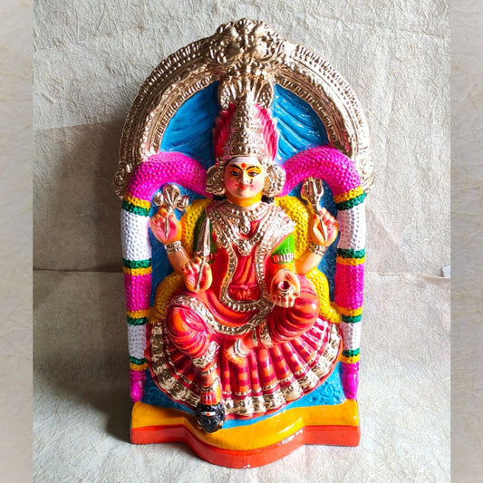 Handcrafted Navarathri Golu doll of Angalamman seated in a traditional posture with vibrant red, gold, and multicolored details.