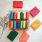 Assorted solid color silk cotton blouse pieces in vibrant shades, ideal for saree pairing and custom tailoring