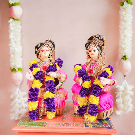 Navaratri Seated Lakshmi Dolls in Vibrant Traditional Attire with Jewelry and Garlands – Handcrafted Festive Decor.