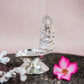 Silver Finish Ganesh Lamp with Intricate Design of Lord Ganesha Seated on a Pedestal.