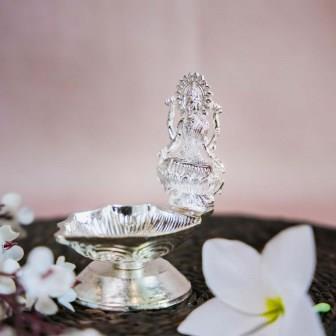 Silver Finish Lakshmi Lamp with Intricate Design of Goddess Lakshmi Seated on a Lotus.